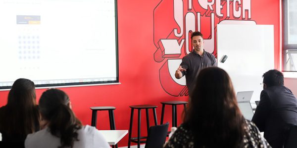 Road Guru founder presenting in front of crowd