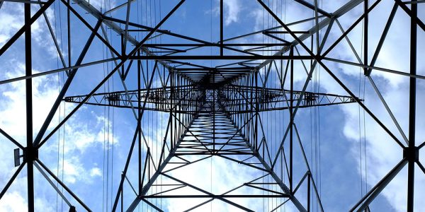 Metal transmission tower underneath